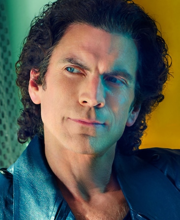 FX's The Shards Wes Bentley as Terry Schaffer wearing a blue leather suite with green hued light, lighting his face. 