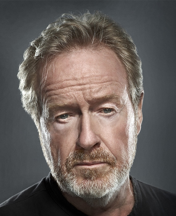 Ridley Scott headshot in plain black t shirt with bright light illuminating face against plain dark grey background