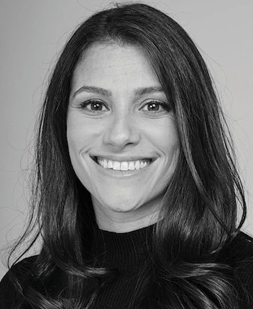 Black and white headshot of executive producer of FX's Necaxa, Jackie Cohn, wearing a black turtleneck.