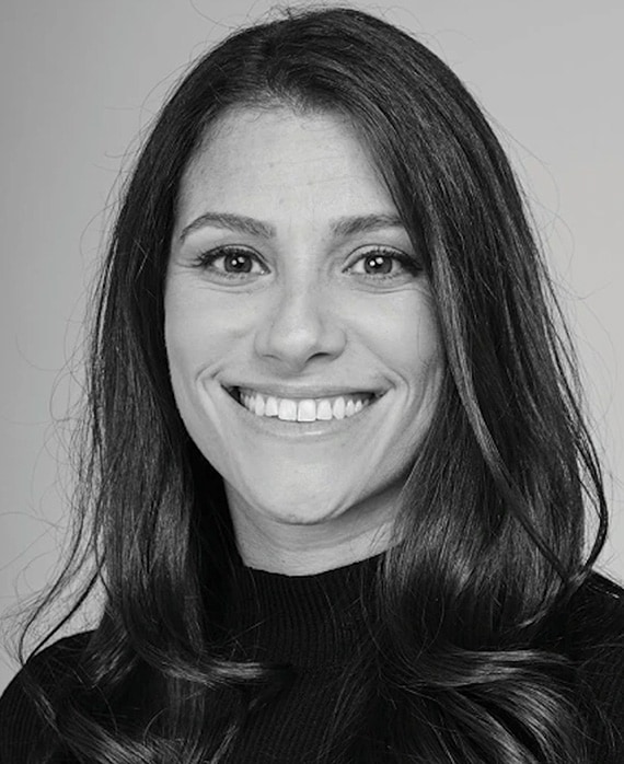 Black and white headshot of executive producer of FX's Necaxa, Jackie Cohn, wearing a black turtleneck.