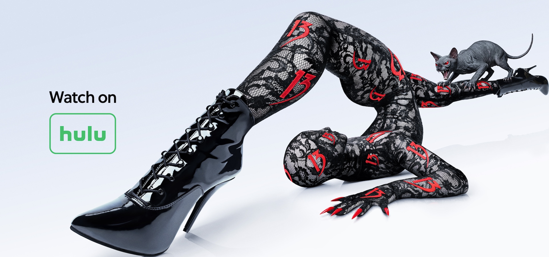 Contortionist posing wearing a lace bodysuit with "13" throughout it, a sphinx cat with red eyes is screeching on her leg.