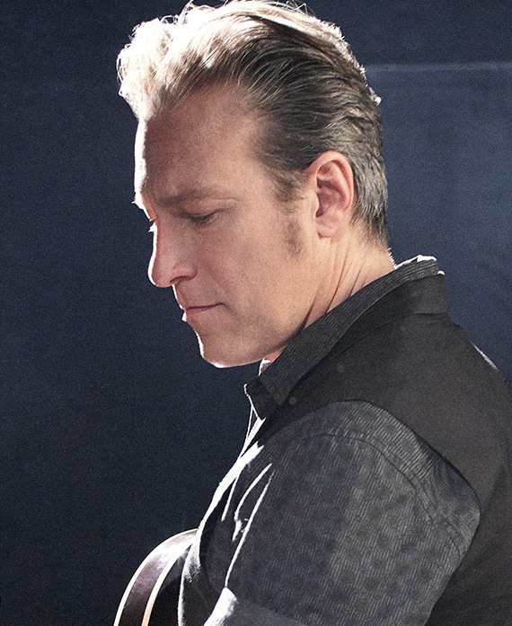 John Corbett headshot wearing a black shirt
