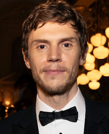 Evan Peters headshot wearing a black suit with a black bowtie for AHS: 13