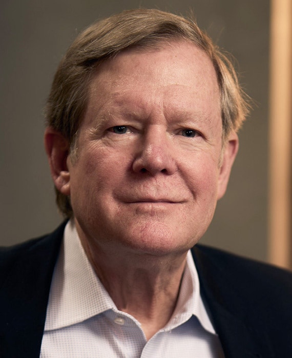 Peter Leonard headshot wearing a white shirt with a black suit jacket