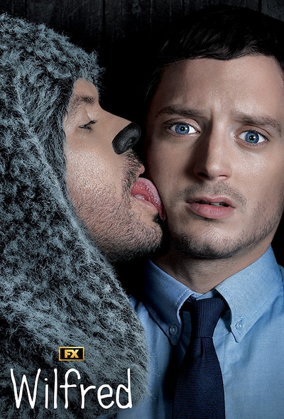 Man in dog costume licking another man's cheek for FX's Wilfred