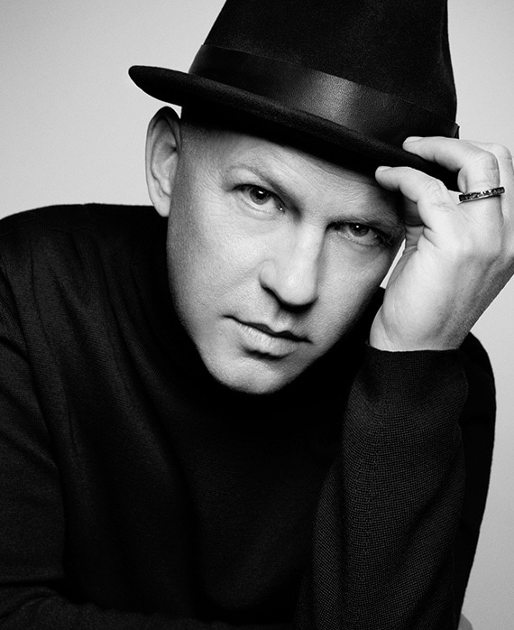 Ryan Murphy black and white headshot wearing black fedora in black sweatshirt