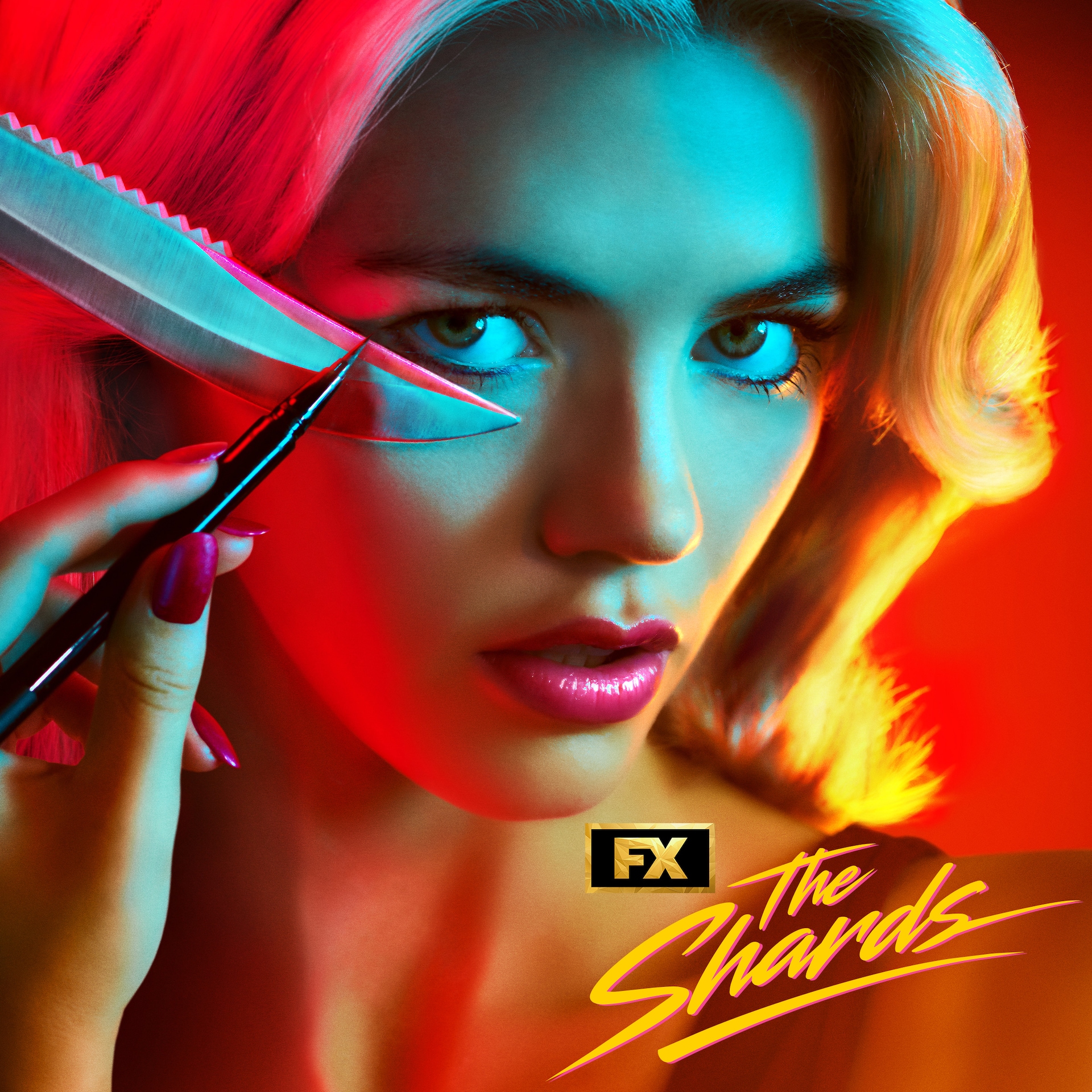 Hayes Warner facing the camera while applying makeup with a knife and eyeliner