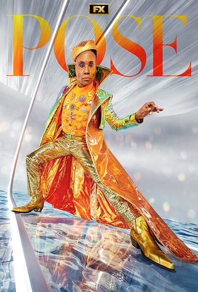 Billy Porter poses in orange and gold outfit against a silver background for POSE