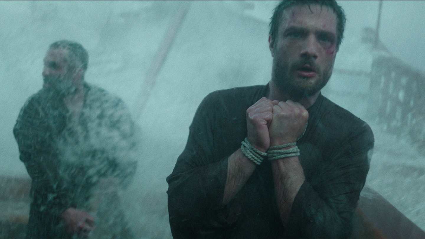 Blackthorne aboard Toranaga's galley in the pouring rain injured and wrists bound 
