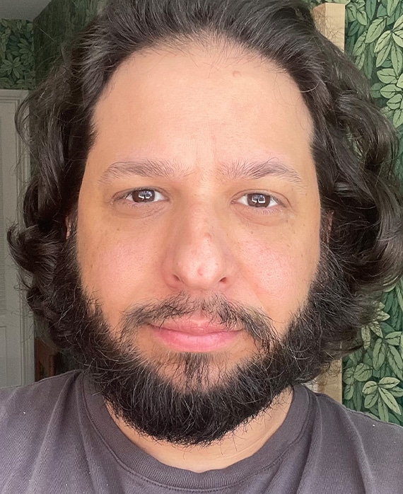 Headshot of executive producer Dave King, wearing a brown tshirt.